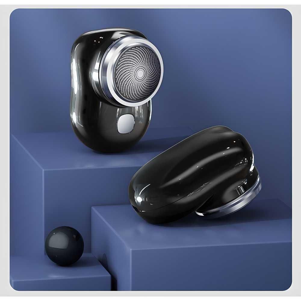 Black and silver electronic device on a blue geometric background